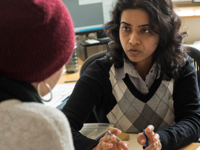 Faculty member communicating with a student