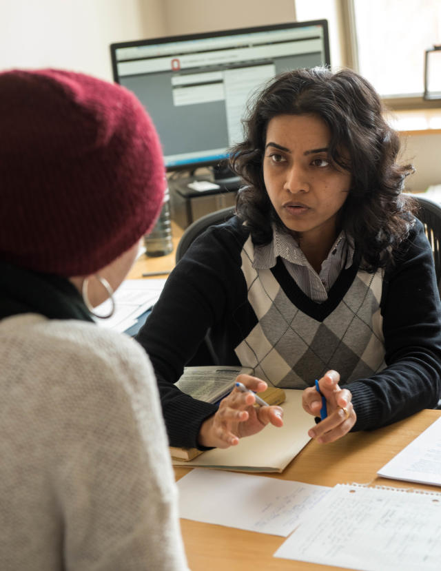 Faculty member communicating with a student